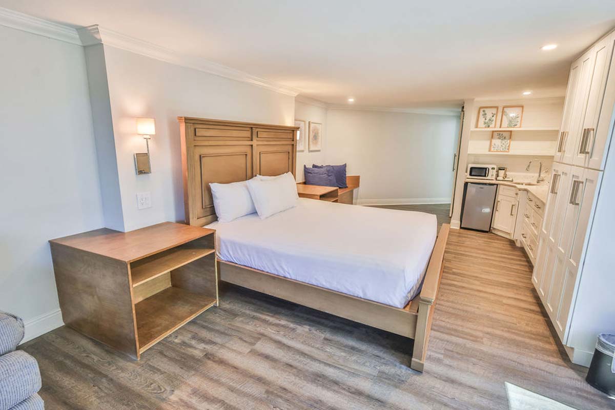 Bright studio room with wood flooring near Fort Walton Beach and access to hotel pool.